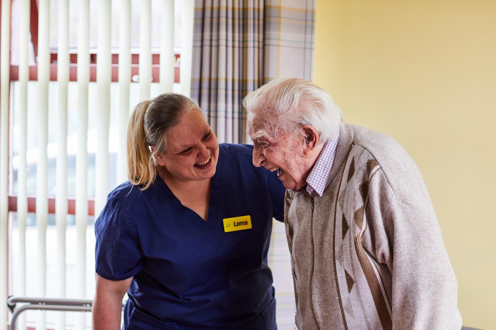 Deputy Manager, Lorna, and resident gentleman laughing at Spiers Care Home