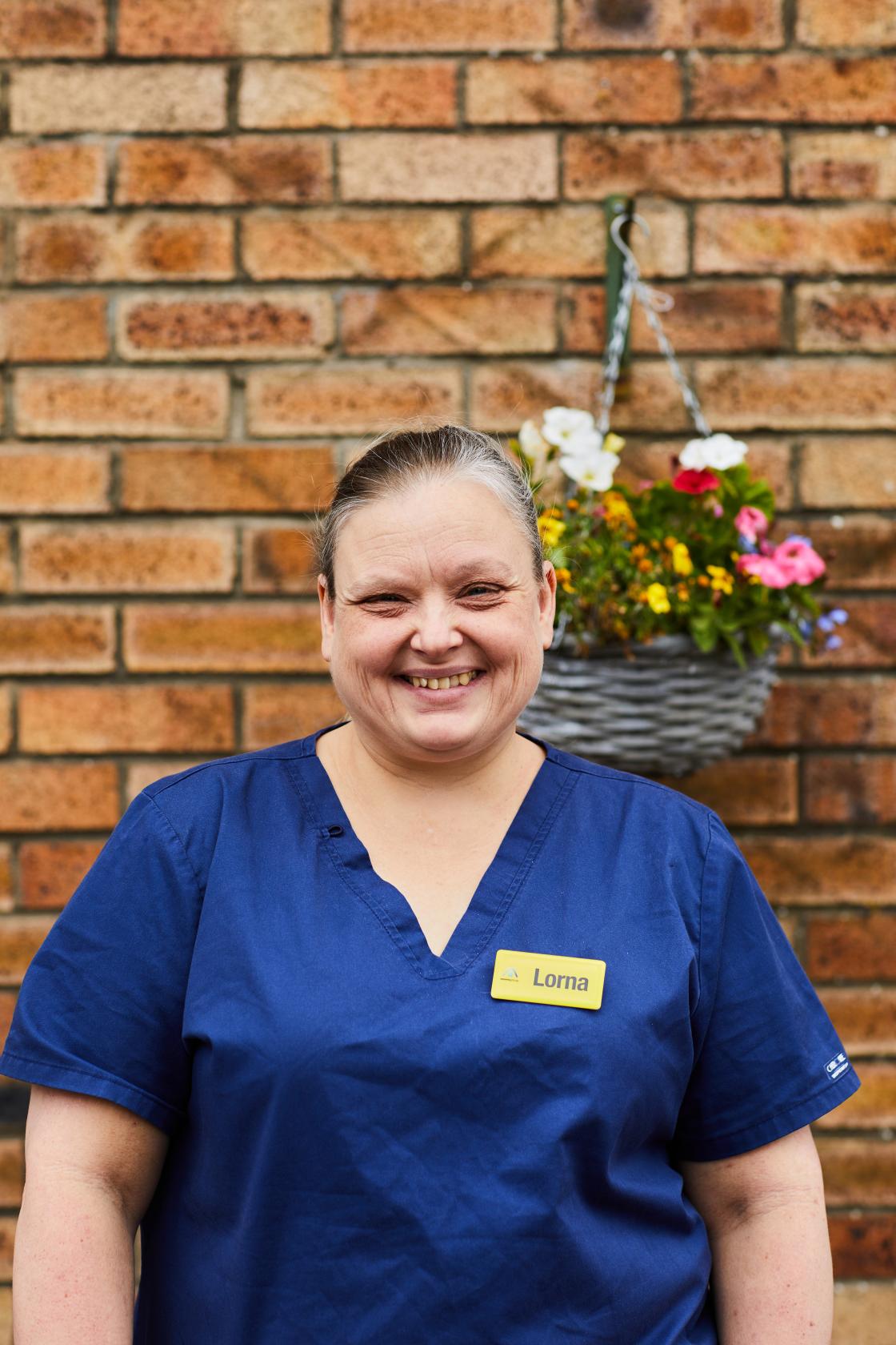 Spiers Care Home Deputy Manager Lorna in her royal blue scrubs
