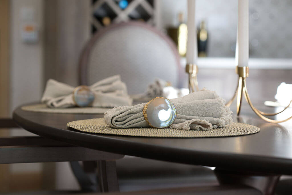 Close up of napkin and stone napkin ring.